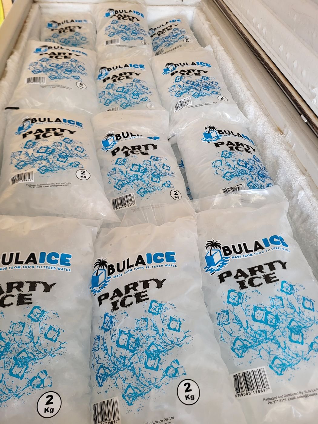 2 kg Party Ice bags lined up in a freezer