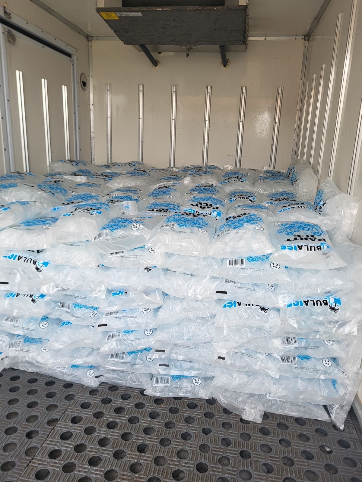 Inside the Bula Ice truck, stacked full of Party Ice bags