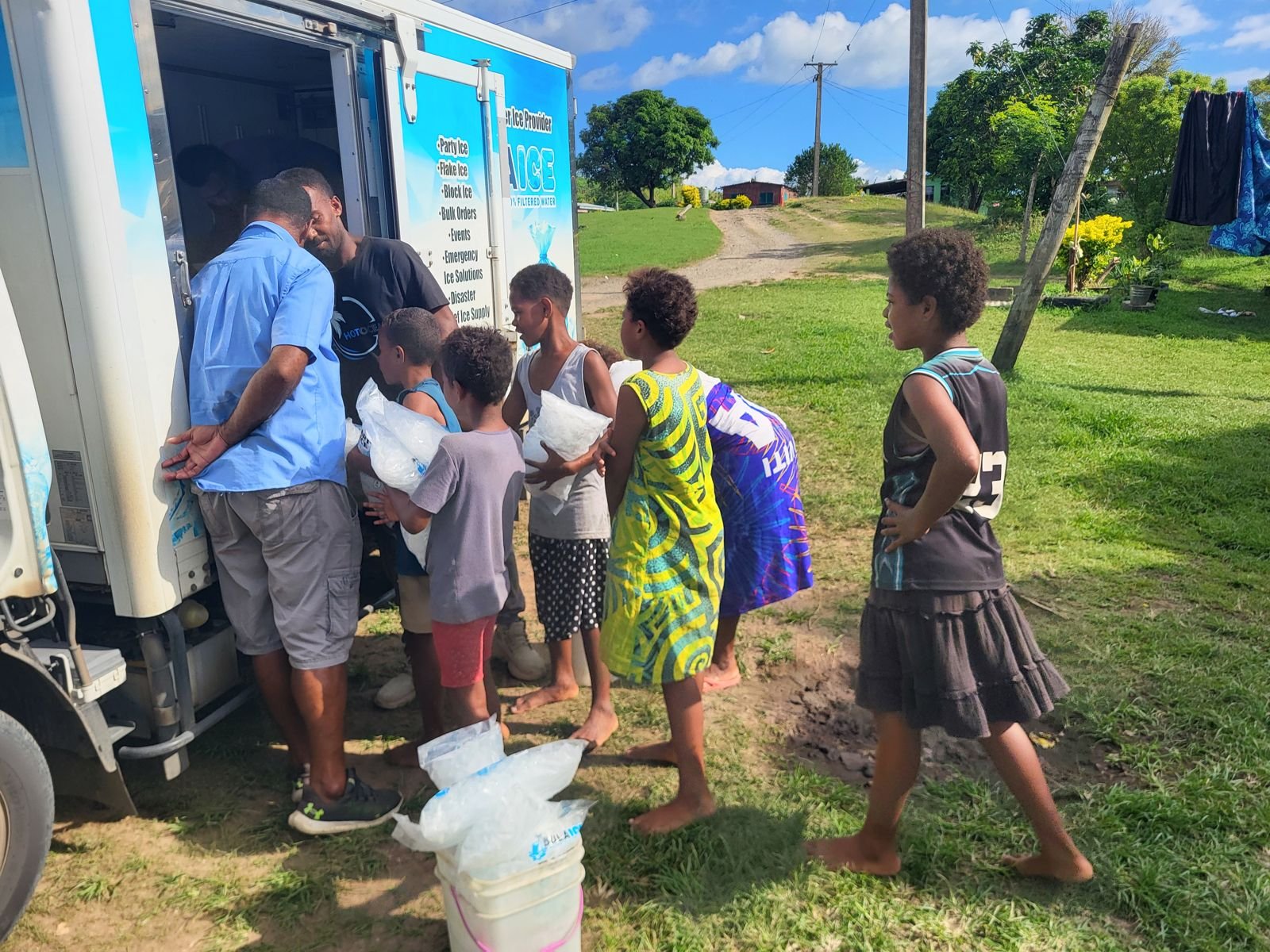 Kids lining up for ice at the Bula Ice truck